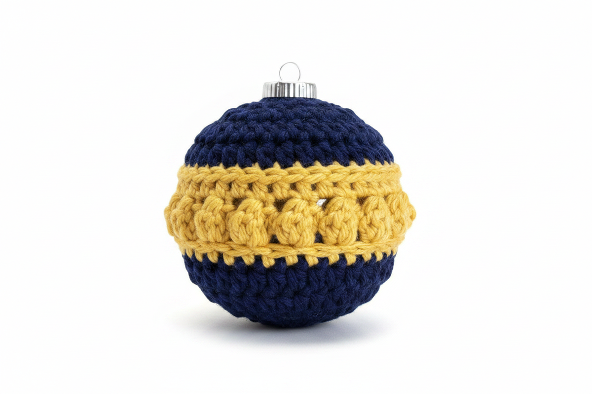 Crocheted ornament in navy blue and yellow gold yarn